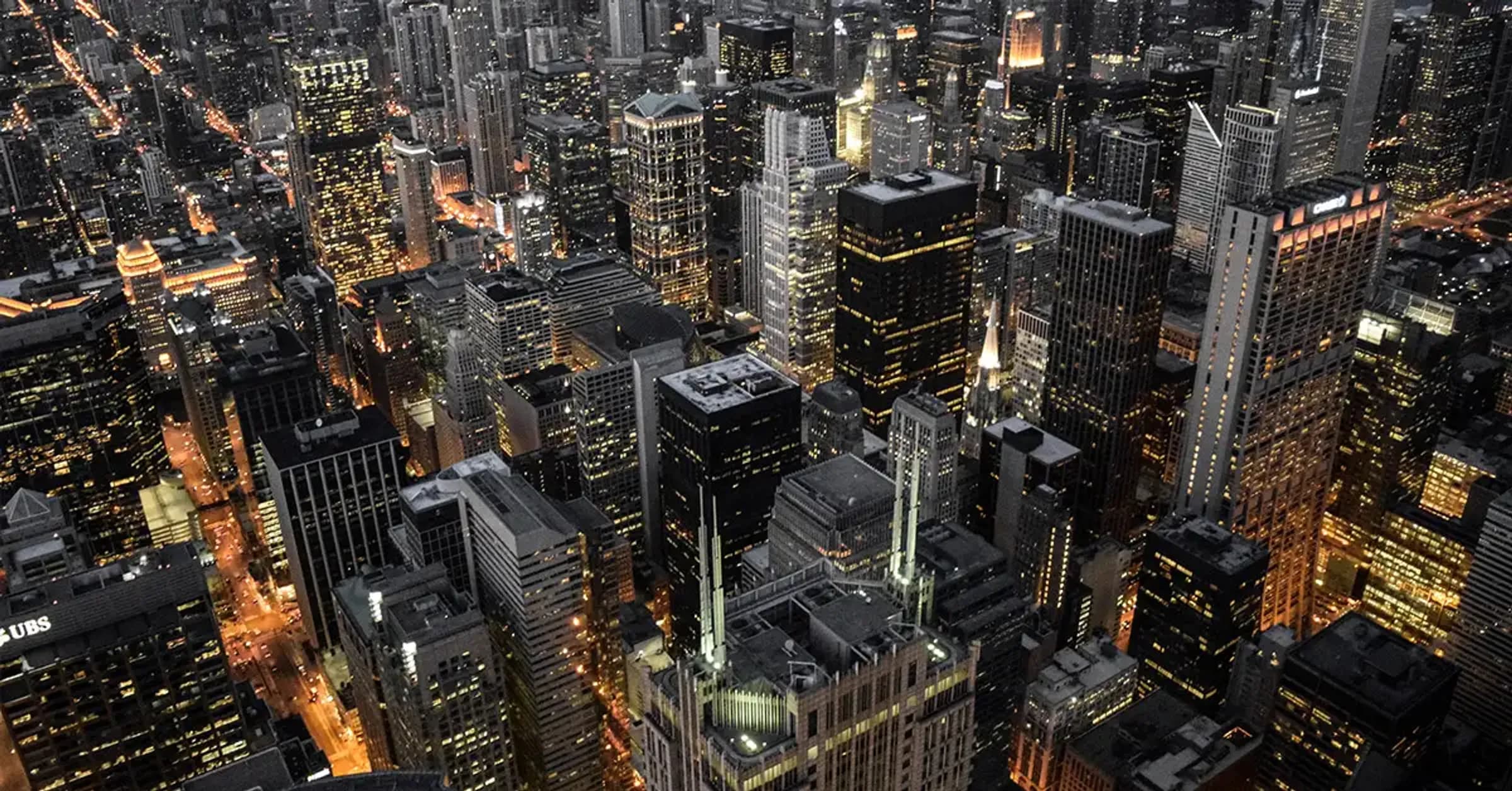 Nighttime aerial view of a city skyline