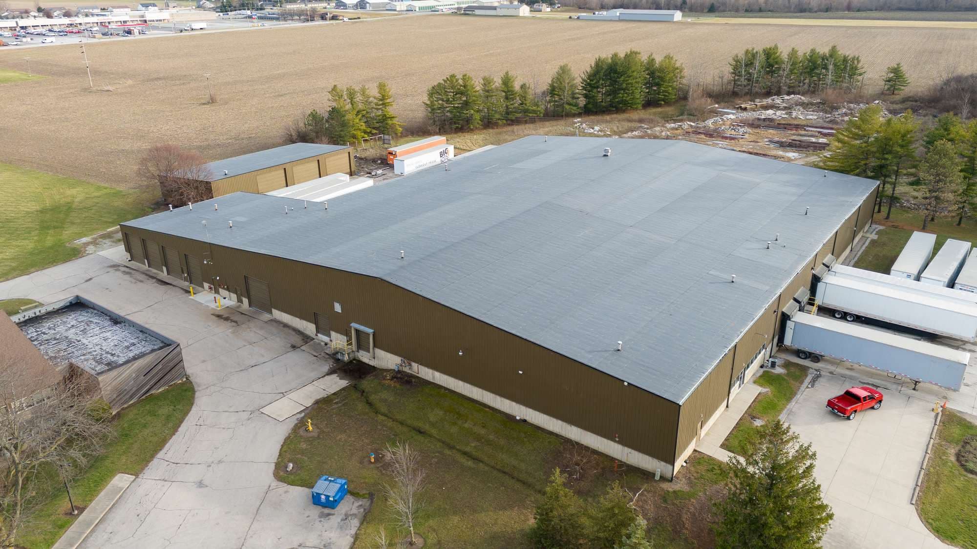 Aerial view of the Hershey NNN warehouse at 120 Harvest Road, Bluffton, Indiana, showing the full EPDM roof and truck court